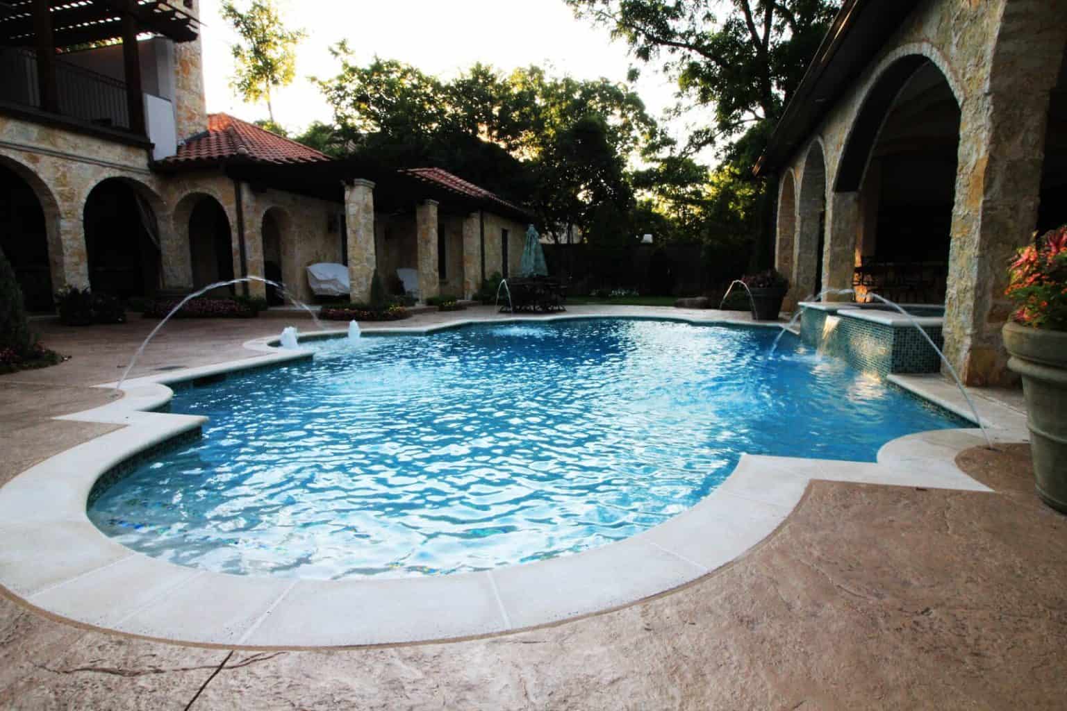 A raised overflowing spa, deck jets and tanning ledge bubblers. Water Features are fun accents that add to any pool design. By adding pool automation, you can control these effects from a handheld remote or smart phone device. The swimming pool industry is adding new features like these all the time and we are at the forefront of leading innovations.