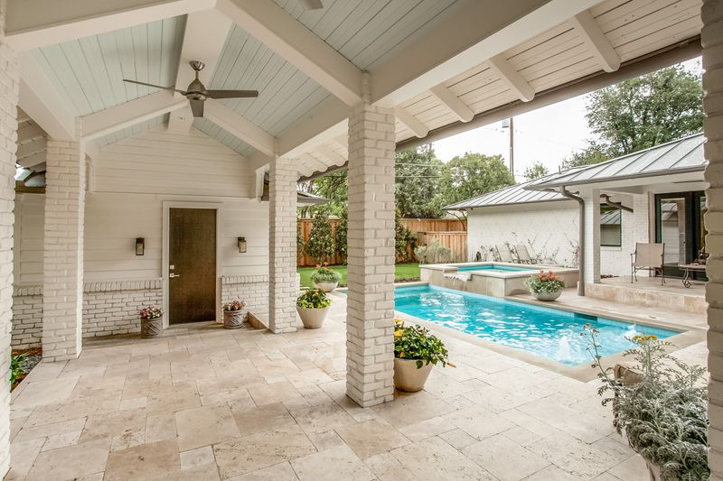 outdoor sitting area next to pool