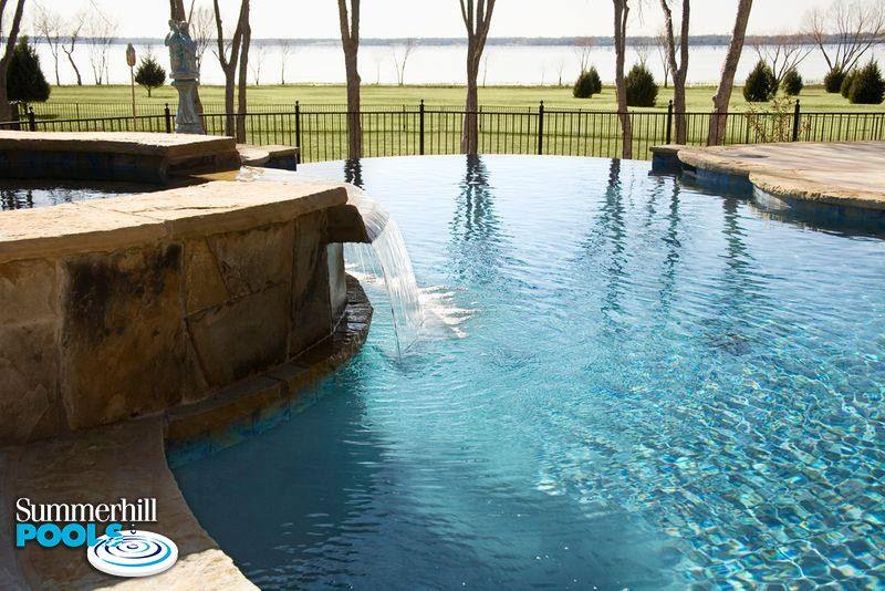 infinity pool over looking a lake