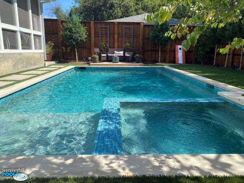 Modern pool with blue tile