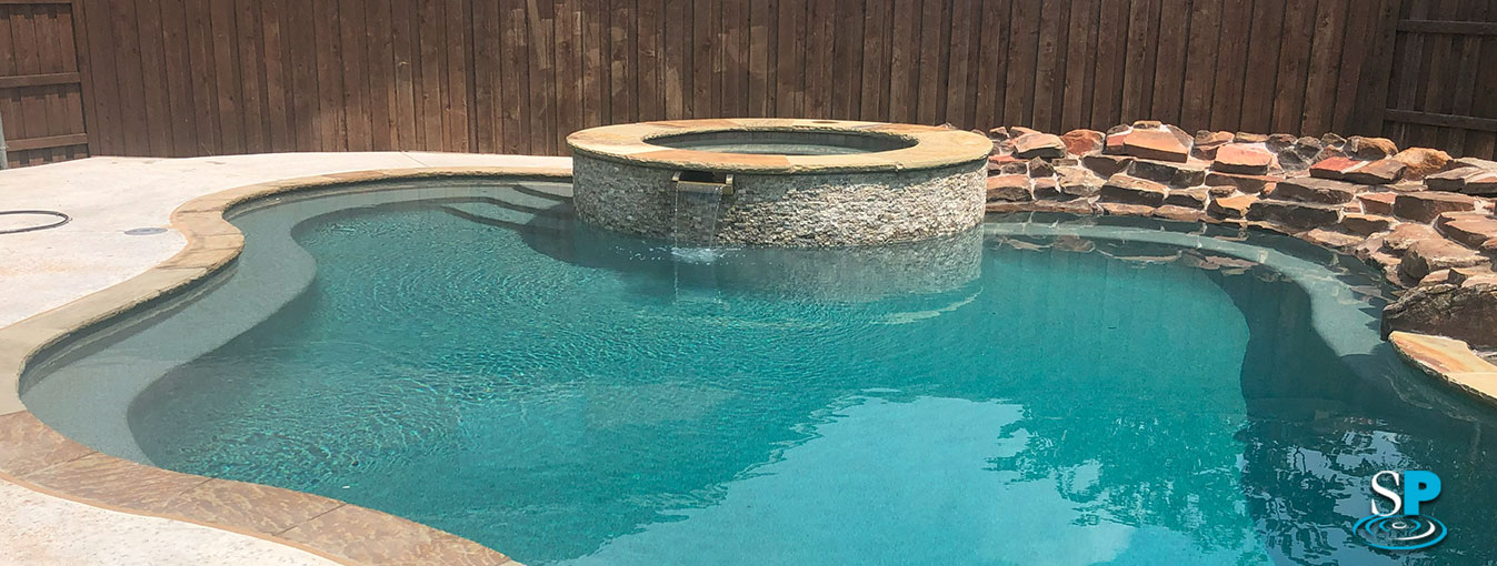 pool with a raised spa