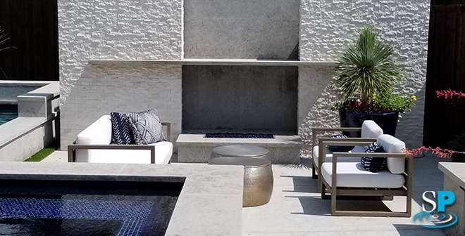 a huge wall with built in fire pit