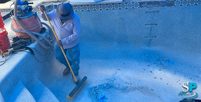 pool employees plastering a pool