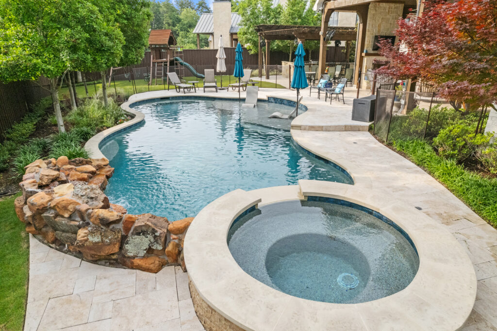 Lagoon pool with swings and privacy fence
