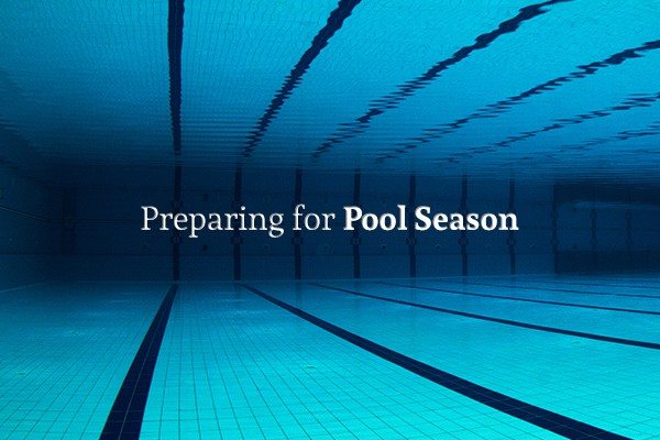Picture of an Olympic sized pool from the perspective of someone under water, with the words "Preparing for Pool Season"